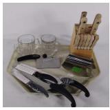 Meat knives and 2 glasses.