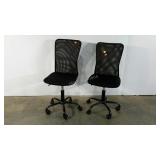 Two mesh backed office chairs, adjustable on