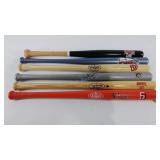 Six Louisville Slugger miniature bats, each