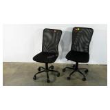 Two mesh backed office chairs, adjustable on