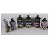 Tiki oil lanterns and statue, one lantern does