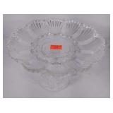 Glass egg plate on pedestal.
