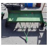John Deere 42" Lawn Plug Aerator, one tire is