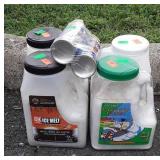 Four partial jugs of ice melt and 2 cutter