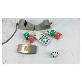 Two whistles, dice, domino, and clip