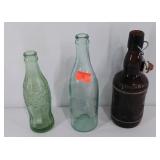 Three advertising bottles