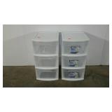 Two Sterilite plastic storage bin towers
