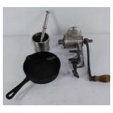 Three metal kitchen items, grinder, small iron