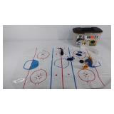 Toy hockey players in carrying case, missing 2