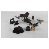Cast items, includes brass lion, horse, anvil,