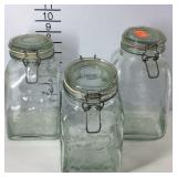Three glass kitchen canisters