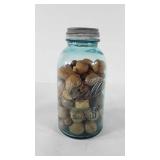 Ball perfect Mason jar full of acorns, walnuts,