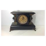 Mantle footed clock, lion head decor handles some
