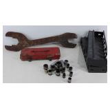 Group of tools, wrench, sockets, small metal tool