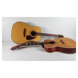 Two wooden acoustic guitars, one marked Fender,