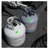 Two Propane Tanks empty, one has air hose adapter