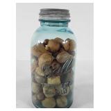 Ball perfect Mason jar full of acorns, walnuts,