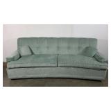 Curved sofa, low-profile, tiny pillows, sea foam