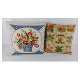 Two crewel work decorative pillows