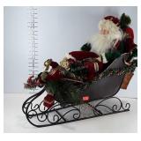 Christmas decor, Santa figure in metal sleigh,