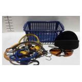 Basket of bungee cords and pair of blue blocker