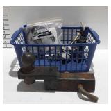 Basket of towing parts, includes hitch pins and