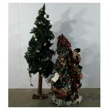 Two decorative Christmas trees, both light,