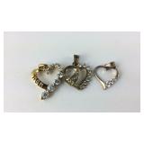 Three Sterling silver heart pendants with stones