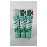 Three cans of Batiste dry shampoo