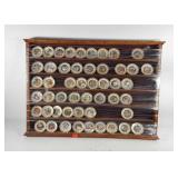 Curio cabinet full of Franklin Porcelain Beat