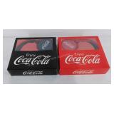 Two pair of Coca-Cola headphones, original box