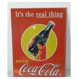 Advertising Coca-Cola metal sign in wrapping