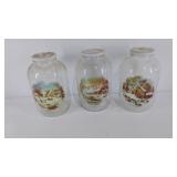 Three jars with lids and Currie and Ives scenes,