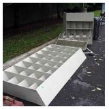 Group of metal bin shelving parts