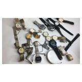 Container with watches and watch parts