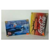 Advertising Coca-Cola metal signs in wrapping