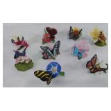 Nine porcelain butterfly and blossom figurines