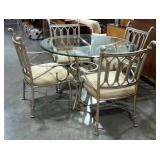 Glass topped table and four chairs, top is 48"