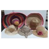 Straw hats, two sombreros, one with floral accent
