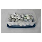 Small storage tote of used golf balls, includes