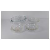 Four Pyrex covered baking dishes
