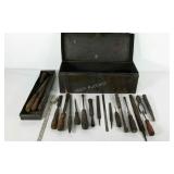 Tool box, full of files, screwdrivers, saw