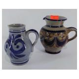 Two ceramic pitchers, larger is marked Handarbet