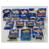 Carded Hot Wheels cars with writing and tape on