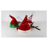 Three lighted and animated Christmas hats, all