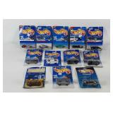 Carded Hot Wheels cars with writing and tape on