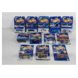 Carded Hot Wheels cars with writing on some