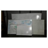 Four whiteboards, various sizes, and a corkboard,