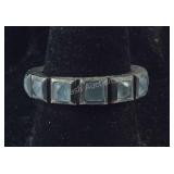Sterling silver band with bluish green stones