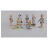 Seven porcelain child figurines, Frances Hook for